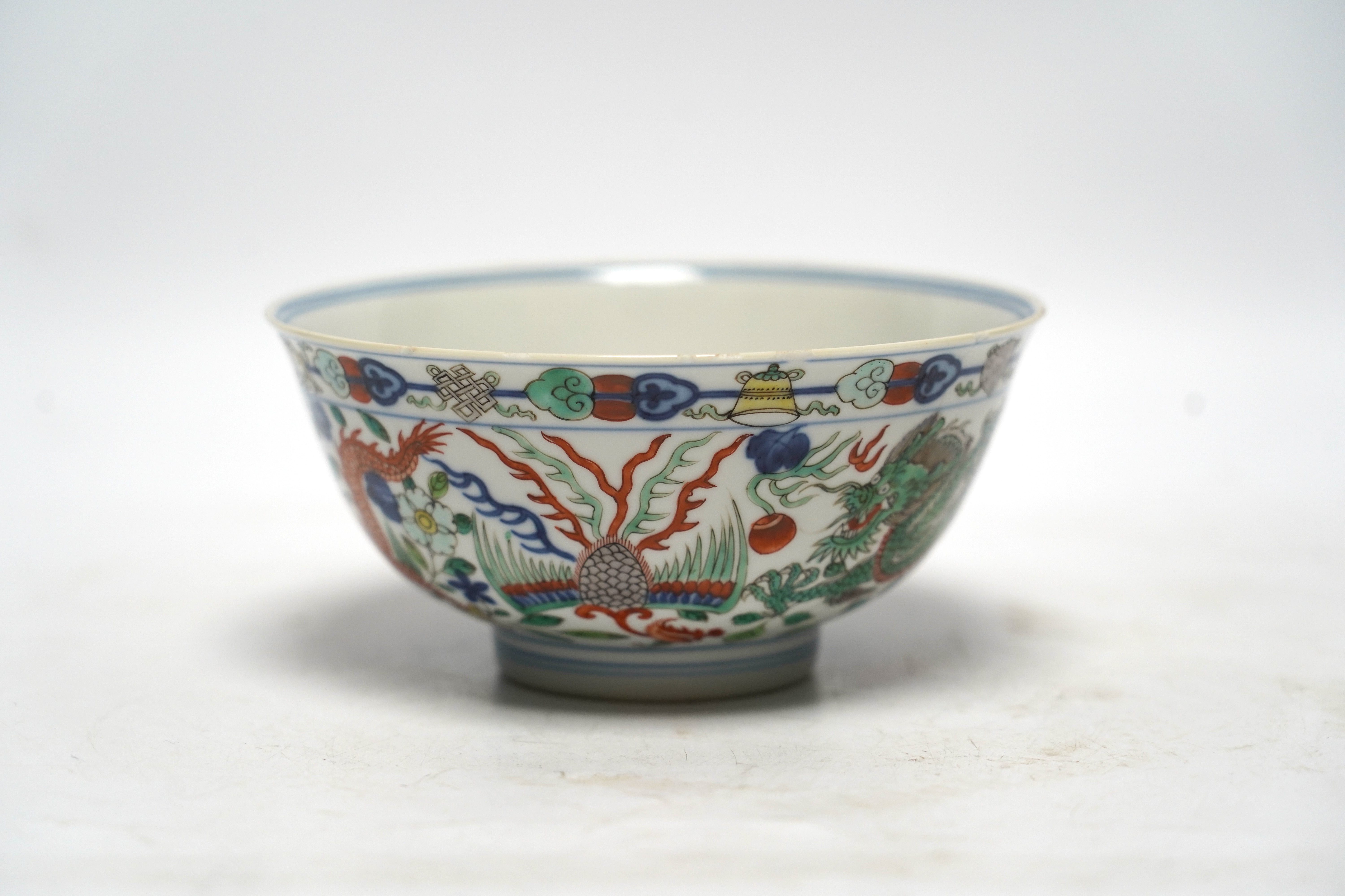 A Chinese wucai ‘dragon and phoenix’ bowl, early 20th century, diameter 15cm